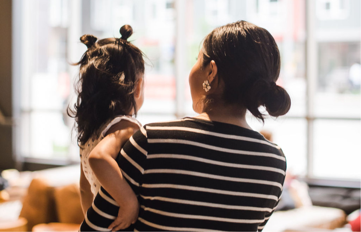 Woman Holds Toddler